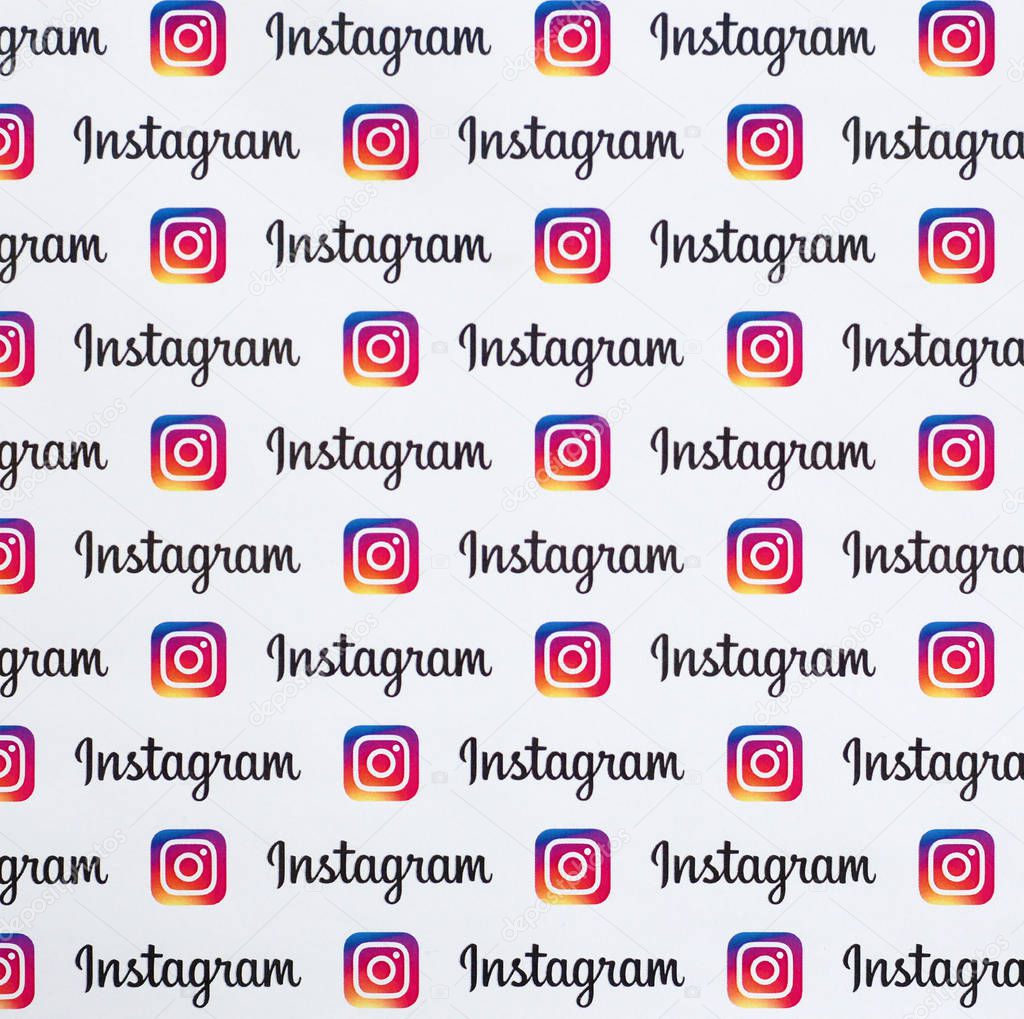 NY, USA - DECEMBER 5, 2019: Instagram pattern printed on paper with small instagram logos and inscriptions. Instagram is American photo and video-sharing social networking service owned by Facebook