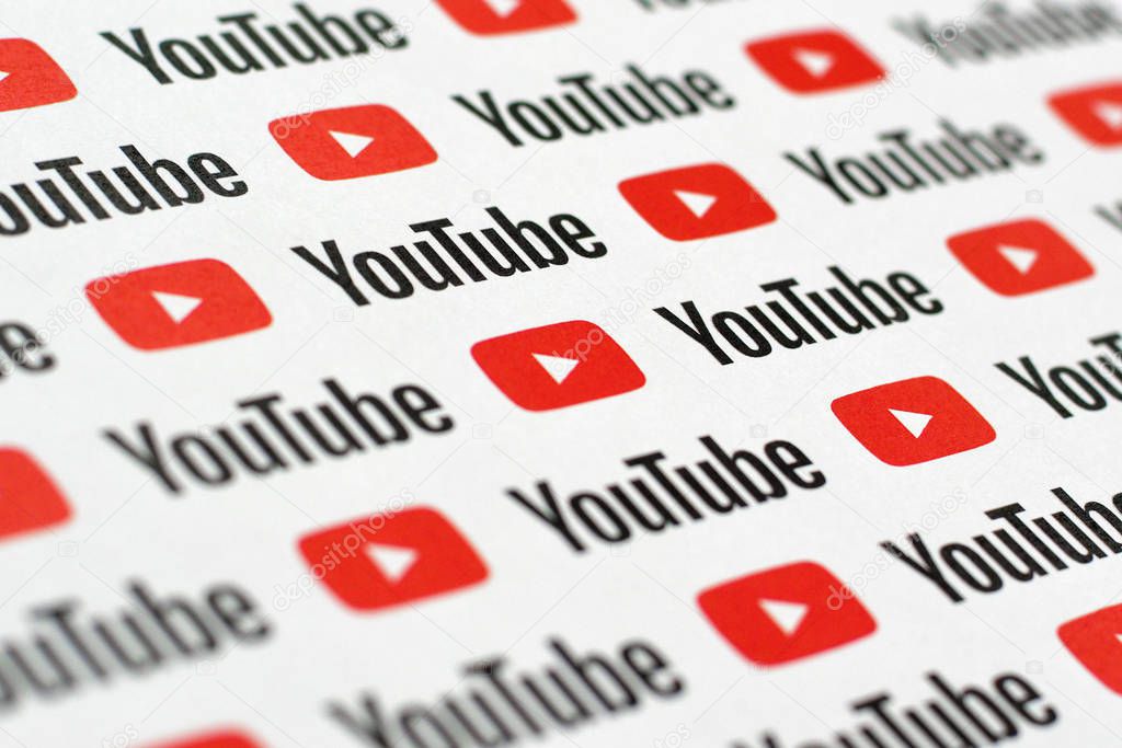 NY, USA - DECEMBER 5, 2019: Youtube pattern printed on paper with small youtube logos and inscriptions. YouTube is Google subsidiary and American most popular video-sharing platform