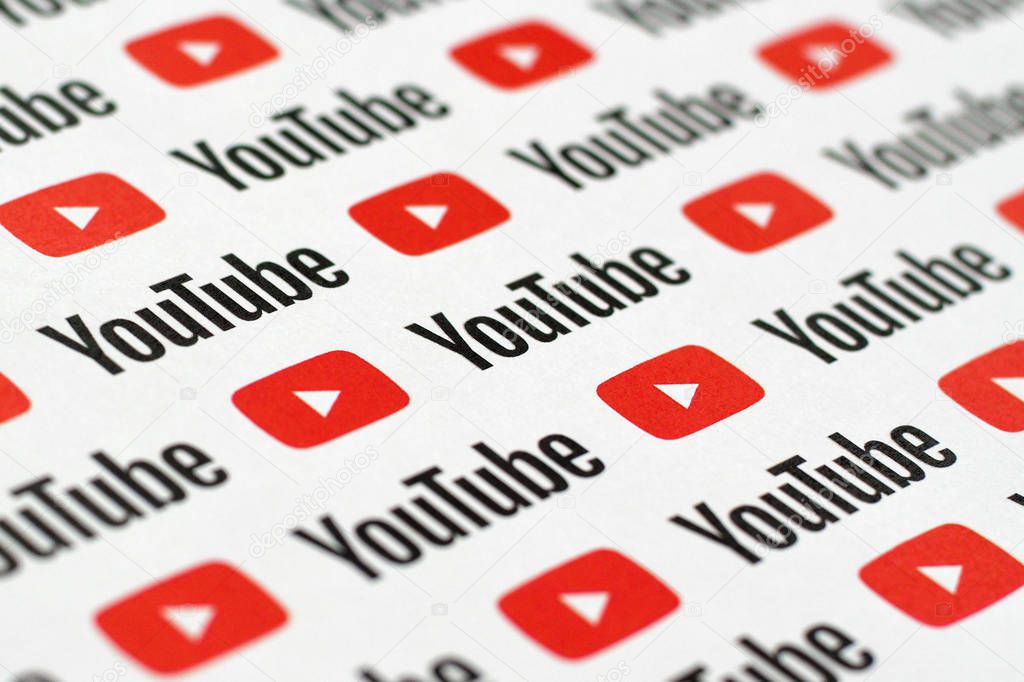 NY, USA - DECEMBER 5, 2019: Youtube pattern printed on paper with small youtube logos and inscriptions. YouTube is Google subsidiary and American most popular video-sharing platform