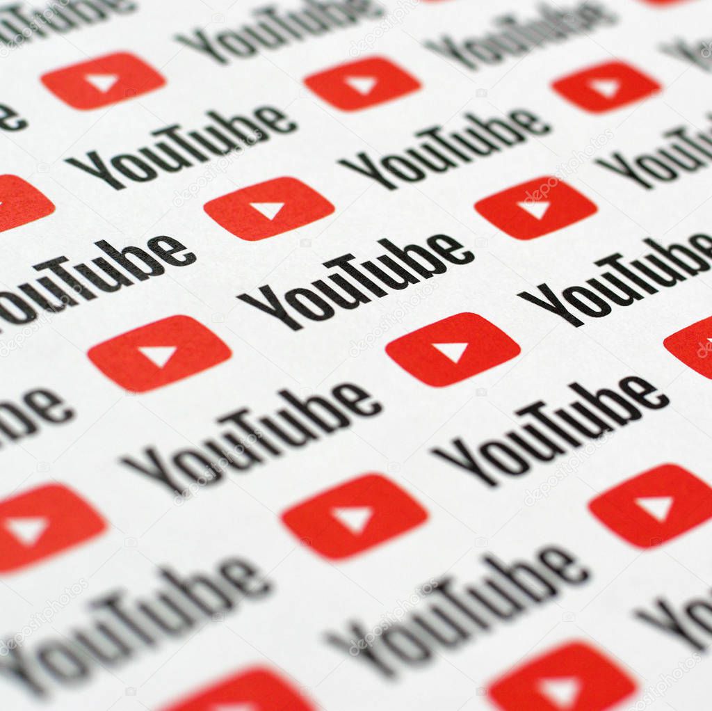 NY, USA - DECEMBER 5, 2019: Youtube pattern printed on paper with small youtube logos and inscriptions. YouTube is Google subsidiary and American most popular video-sharing platform