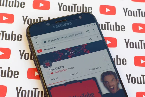 Pewdiepie official youtube channel on smartphone screen on paper — Stock Photo, Image