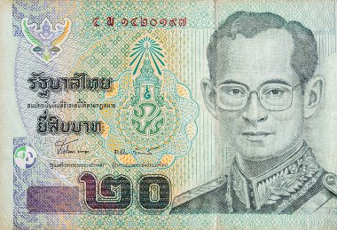 Kral Bhumibol Adulyadej 20 Baht Tayland para faturasını kapatıyor.