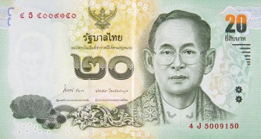 Kral Bhumibol Adulyadej 20 Baht Tayland para faturasını kapatıyor.