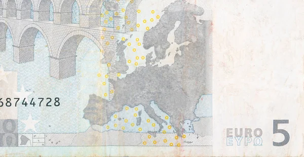 Fragmento parte del billete de 5 euros en primer plano con pequeños detalles marrones —  Fotos de Stock