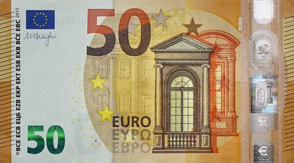 Fragment part of 50 euro banknote close-up with small brown details — Stock Photo, Image