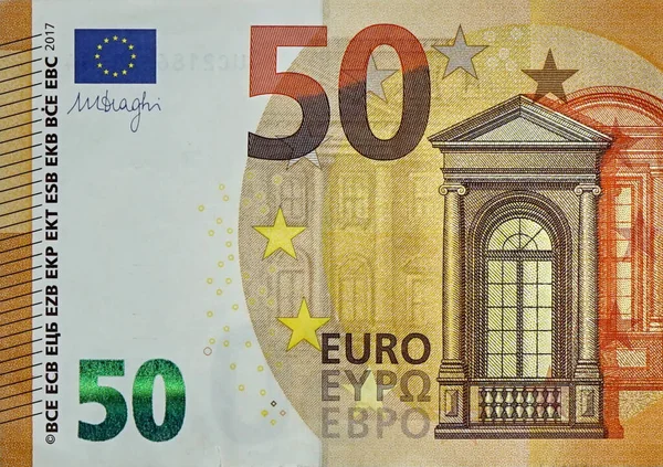 Fragmento parte del billete de 50 euros en primer plano con pequeños detalles marrones —  Fotos de Stock