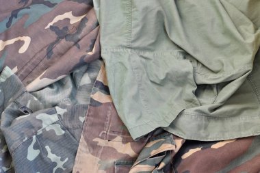 Camouflage background texture as backdrop for army and military design projects clipart