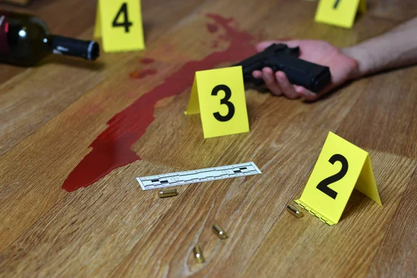 Bloody crime scene with dead body and gun on floor. Many crime scene investigation markers indoors