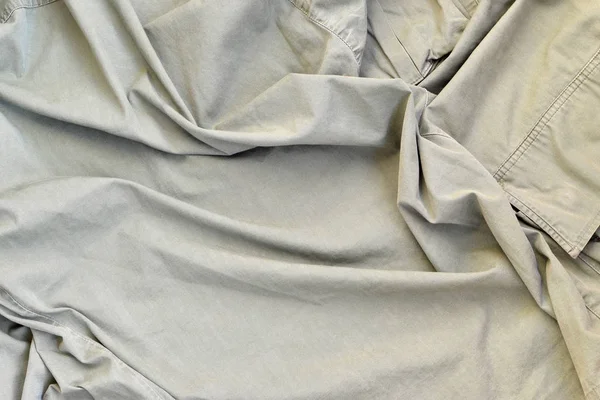 Kumaşın dokusu zeytin renginde. İkinci Dünya Savaşı 'ndaki Amerikan askerlerinin üniformasına benziyor.