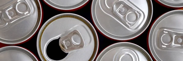 Many cans of soda soft drink or energy drink containers. A lot of recycled cans made from aluminum and being prepared for re-production. — Stock Photo, Image