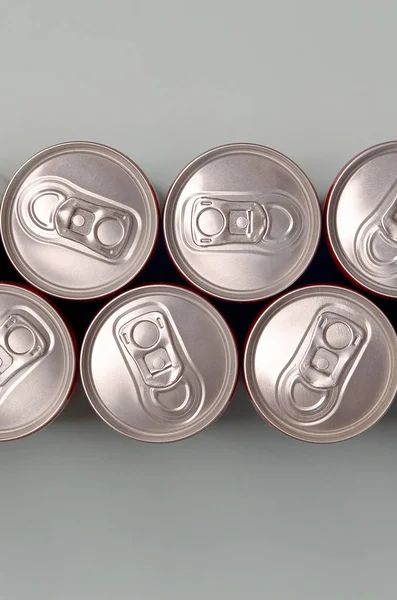 Many new aluminium cans of soda soft drink or energy drink containers. Drinks manufacturing concept and mass production — 스톡 사진