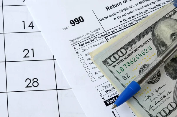 Form 990 Return of organization exempt from income tax and blue — Stock Photo, Image