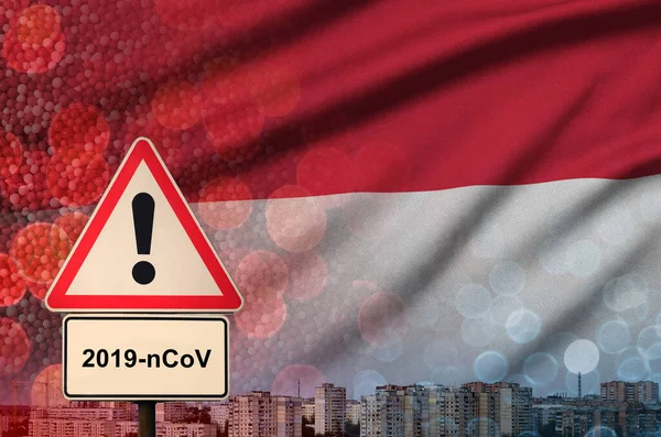 Monaco flag and Coronavirus 2019-nCoV alert sign. Concept of high probability of novel coronavirus outbreak through traveling tourists