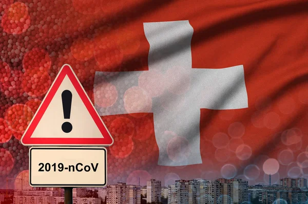 Switzerland flag and Coronavirus 2019-nCoV alert sign. Concept of high probability of novel coronavirus outbreak through traveling tourists