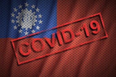 Myanmar bayrağı ve kırmızı Covid-19 damgası. Coronavirus 2019-nCov salgını kavramı