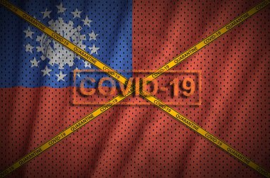 Myanmar bayrağı ve turuncu karantina sınır bandı haçlı Covid-19 damgası. Coronavirus veya salgın 2019-nCov virüs konsepti