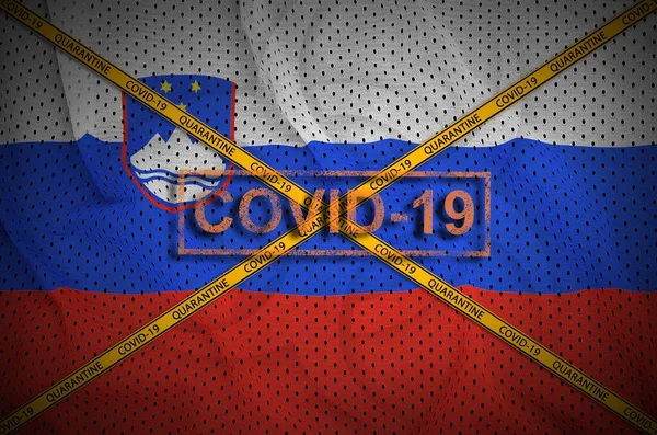 Slovenia flag and Covid-19 stamp with orange quarantine border tape cross. Coronavirus or pandemic 2019-nCov virus concept