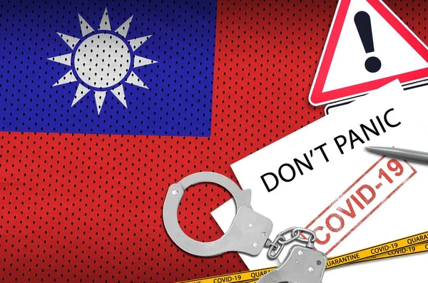 Taiwan flag and police handcuffs with inscription Don\'t panic on white paper. Coronavirus or pandemic 2019-nCov virus concept