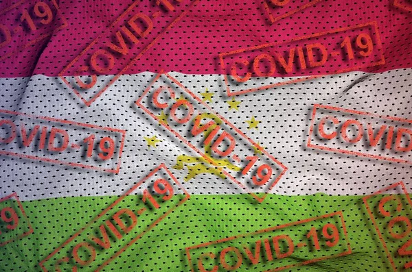 Tajikistan Flag Many Red Covid Stamps Coronavirus Pandemic 2019 Ncov — Stock Photo, Image