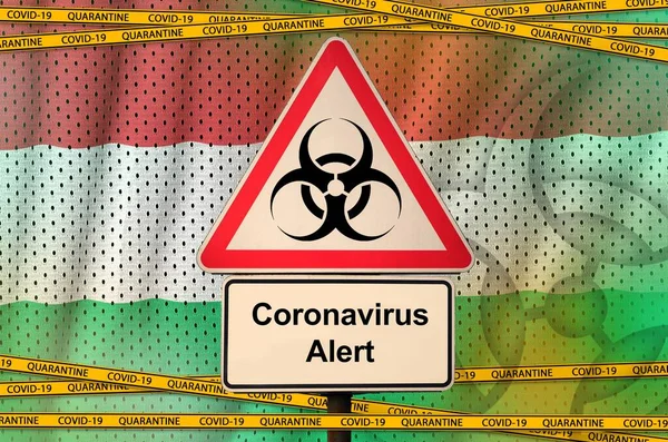 Hungary flag and Covid-19 biohazard symbol with quarantine orange tape. Coronavirus or pandemic 2019-nCov virus concept
