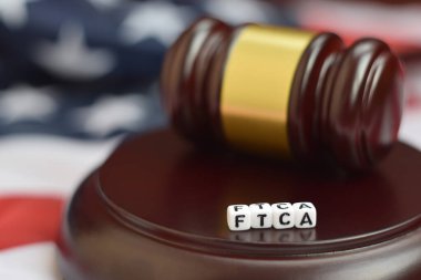 Adalet tokmağı ve FTCA kısaltması yakın çekim. Federal Ticaret Komisyonu Yasası