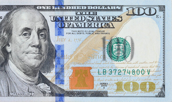 Portrait of US president Benjamin Franklin on 100 dollars banknote closeup macro fragment. United states hundred dollars money bill close up