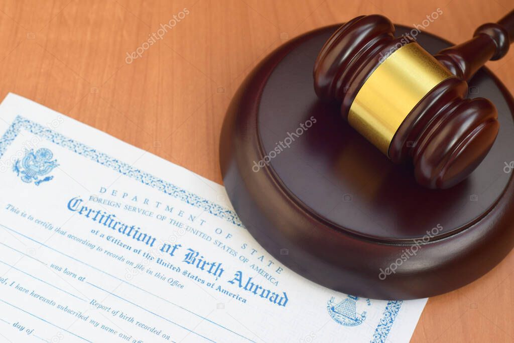 Justice mallet and United States Certificate of Birth Abroad close up
