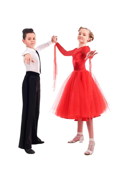 Lovely little boy and girl dancing. Isolated on white background — Stock Photo, Image