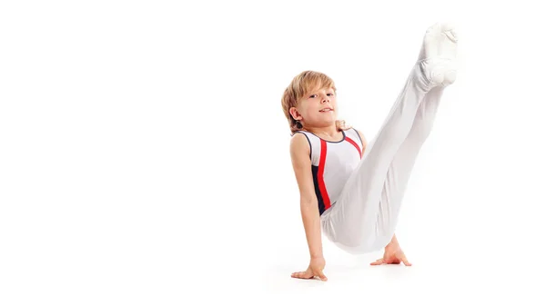 Happy little boy doing gymnastics isolated on white background — Stock Photo, Image