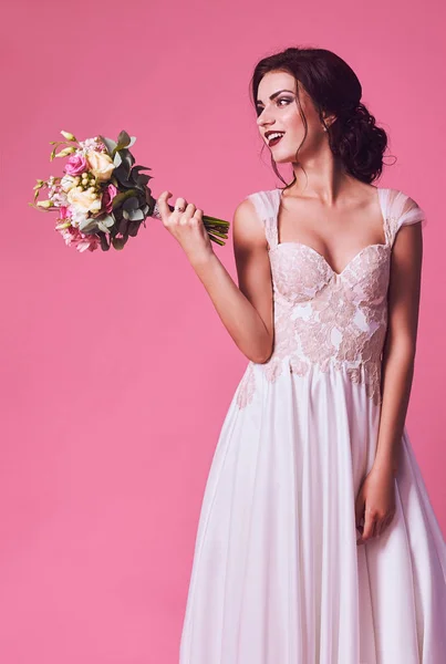 Brunet bride portrait in pink studio — Stock Photo, Image