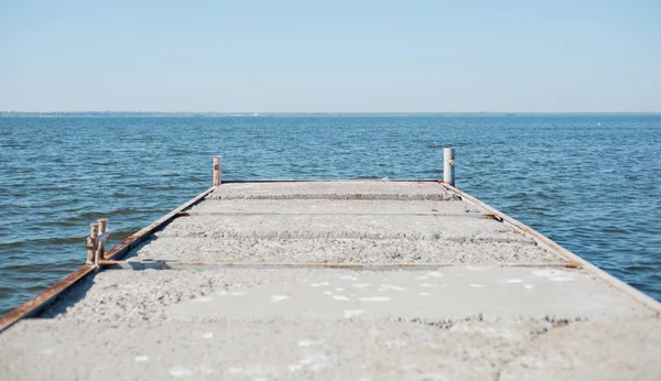 Pier from the reinforced concrete overlooking the river bay