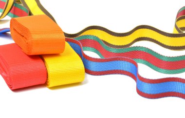 Multicolored top cord ribbons waving on white background clipart