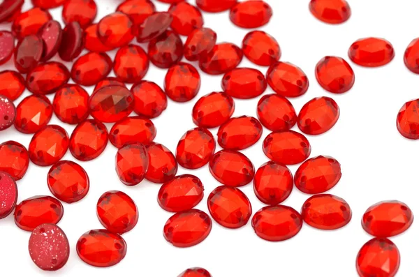 Crimson-red rhinestone on white background — Stock Photo, Image