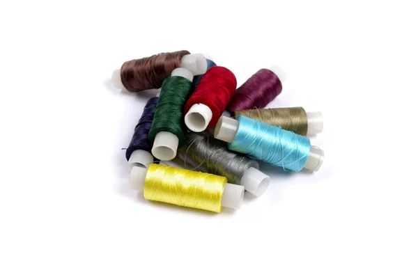 Spools of multicolored silk threads on white background — Stock Photo, Image