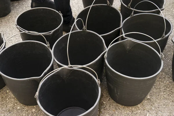 The black buckets pails — Stock Photo, Image