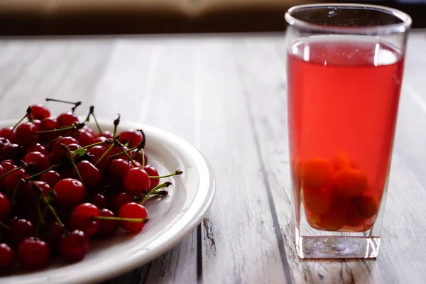 Glass of stewed sweet cherry fruit — Stock Photo, Image