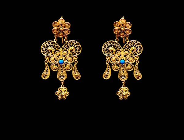 Beautiful vintage Oriental gold Turkish jewelry womens earrings black background — Stock Photo, Image