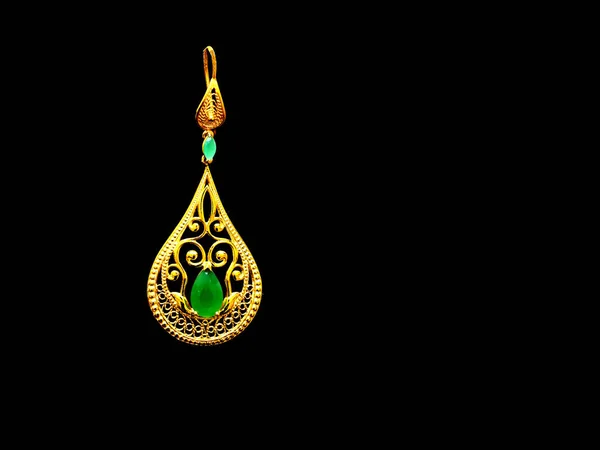 Beautiful Oriental gold Turkish jewelry womens earrings black background — Stock Photo, Image