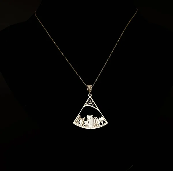 beautiful Oriental, Turkish silver jewelry, women chain with pendants on a black background