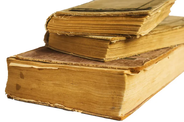 Pila di vecchi libri antichi grandi isolati su sfondo bianco — Foto Stock