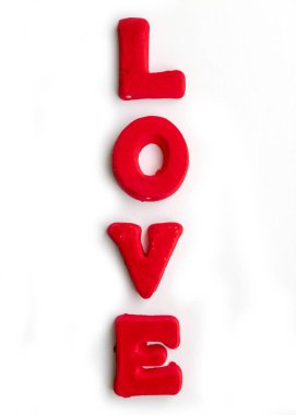 The word Love is made up of red letters on a white background.