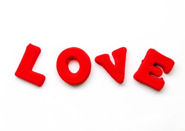 The word Love is made up of red letters on a white background.