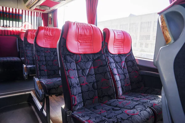 Row of seats inside tourist bus, shot in exhibition