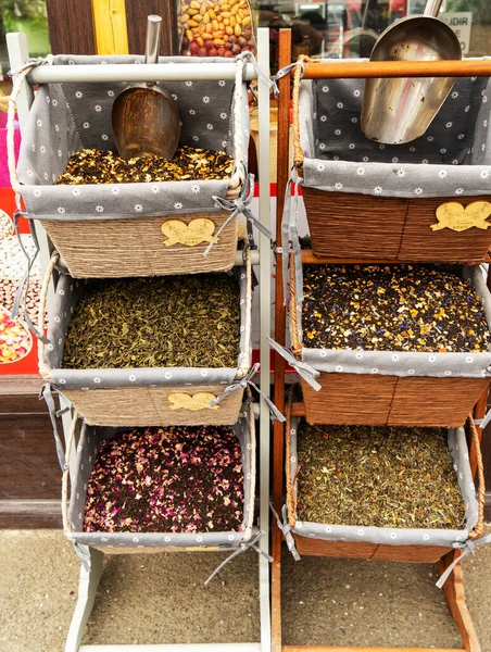 Green, black tea with additives on the shop window for the store. — Stock Photo, Image