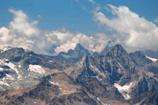 Stock image Caucasus mountains near Elbrus volcano with glaciers, clouds and peaks.