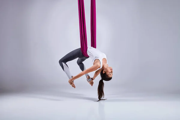 Aerial different inversion antigravity yoga in a hammock — Stock Photo, Image