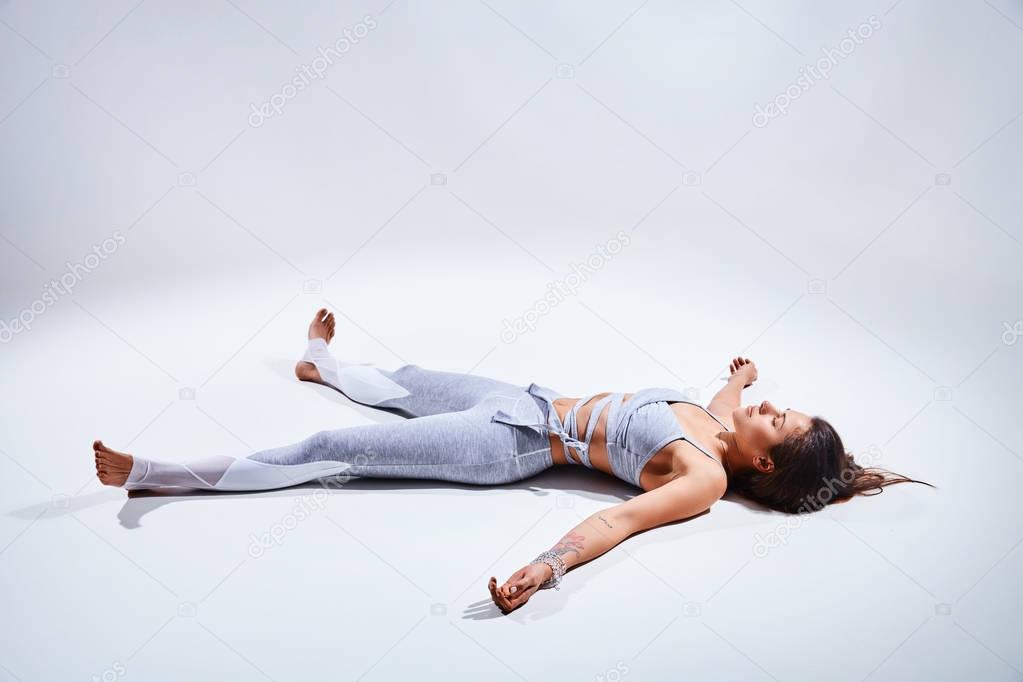 Woman doing yoga isolated on white background