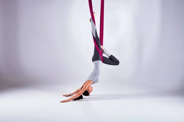 Aerial different inversion antigravity yoga in a hammock — Stock Photo, Image