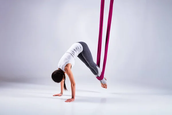 Aerial different inversion antigravity yoga in a hammock — Stock Photo, Image