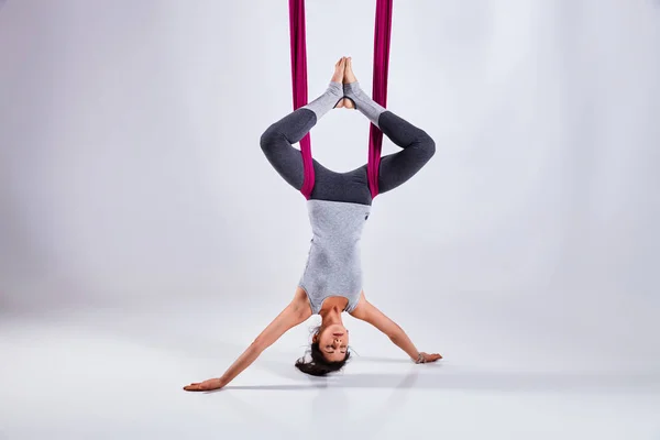 Aerial different inversion antigravity yoga in a hammock — Stock Photo, Image